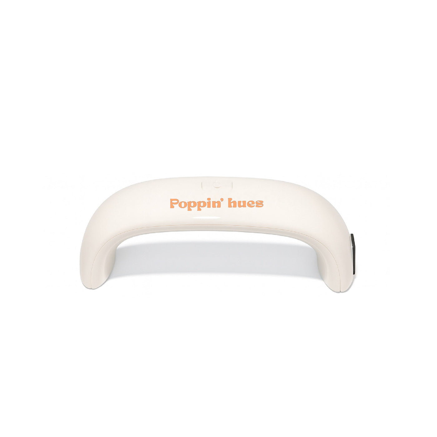 UV/LED nail lamp displayed on a white background, featuring a curved cream-colored design with the Poppin’ hues logo.