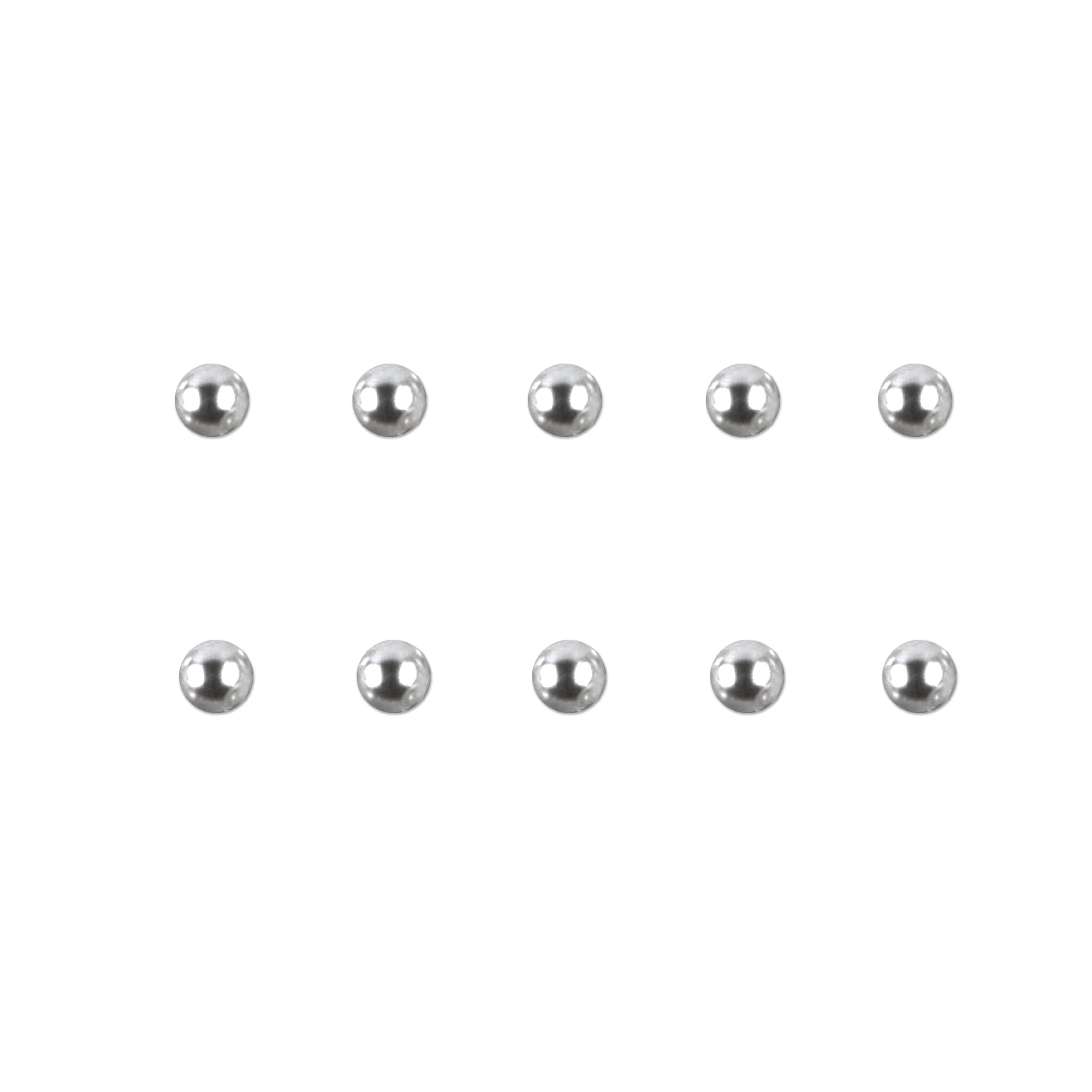 Set of silver chrome nail charms on a white background
