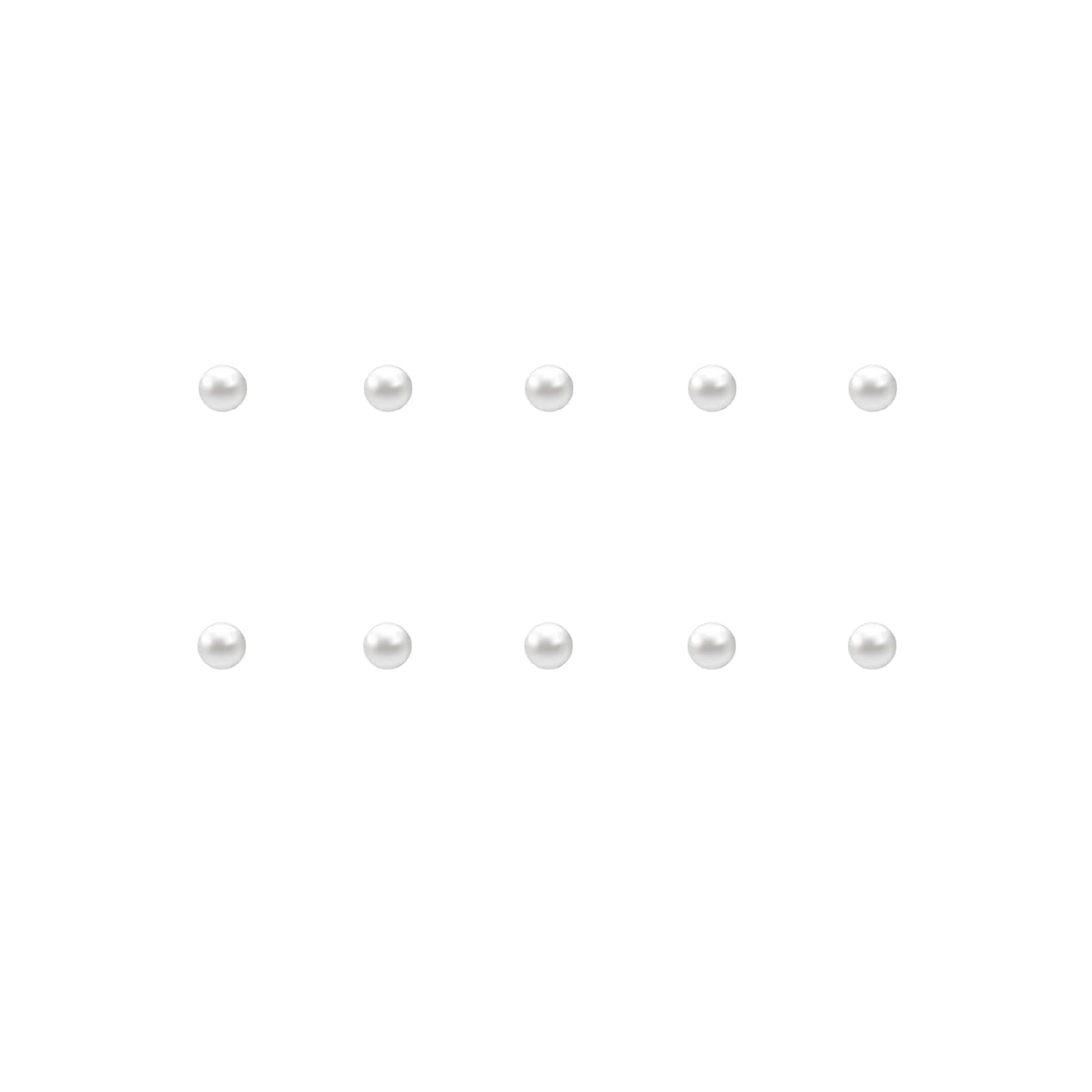 Set of small pearl nail charms on a white background