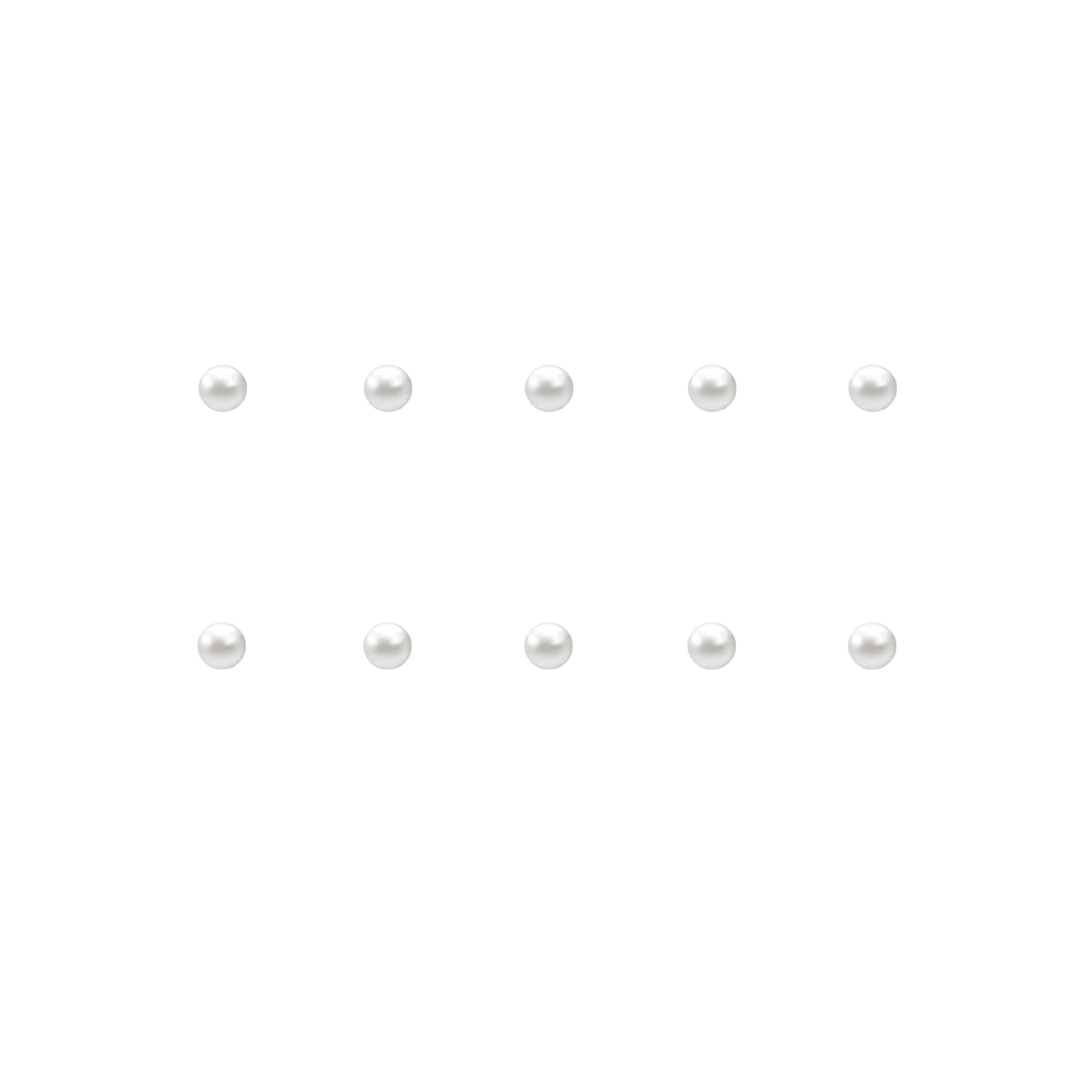 Set of small pearl nail charms on a white background